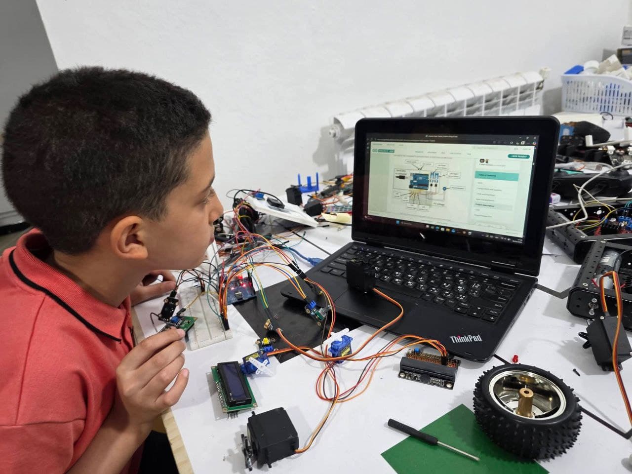 Student building an electronics and robotics project